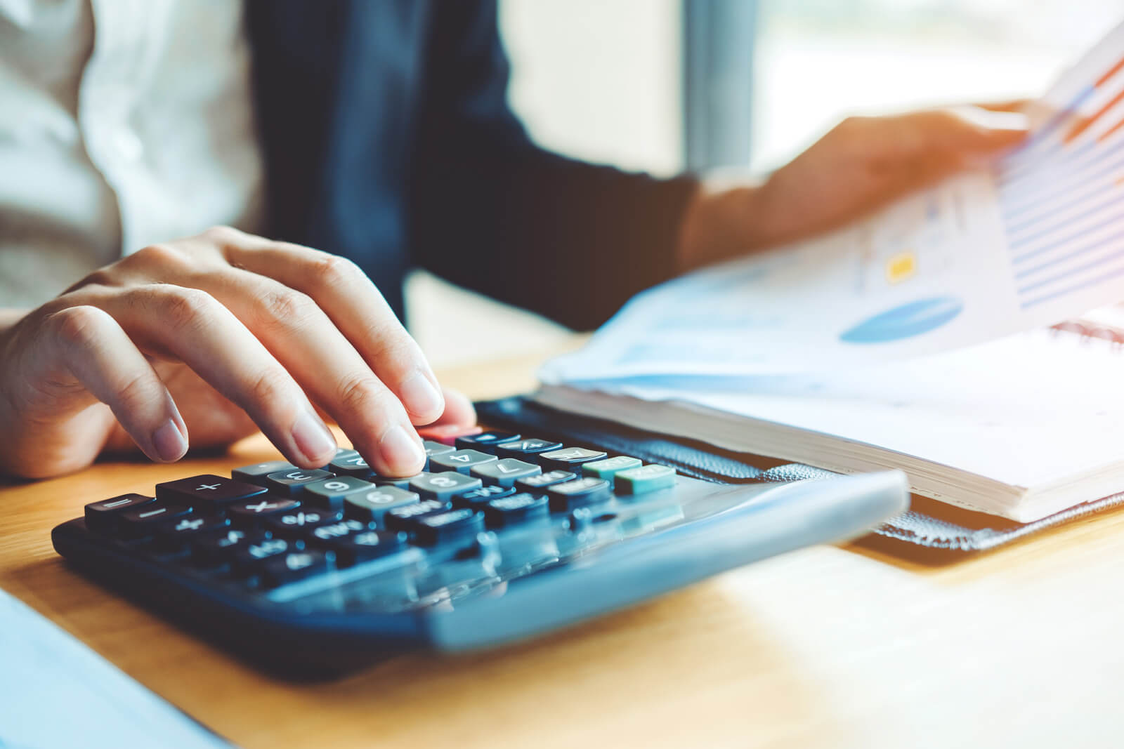 Canva-Business-man-Accounting-Calculating-Cost-Economic-Financial-data-analyzing-counting